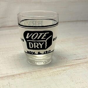 Vintage prohibition shot glass and decanter with federally illegal stamped